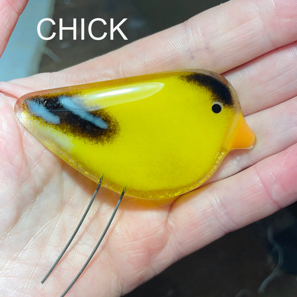 Load image into Gallery viewer, Fused Glass Goldfinch Chick Ornament with Hand for Scale
