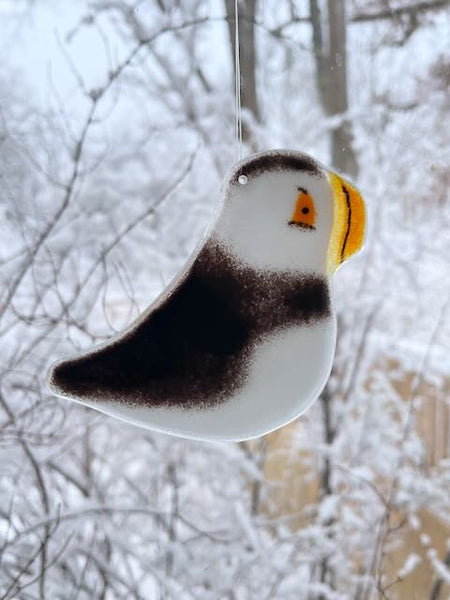 Load image into Gallery viewer, Black and White Fused Glass Puffin Hanging in Window with Snow