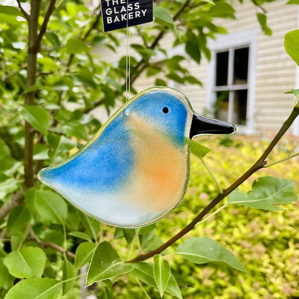 Load image into Gallery viewer, Blue White and Peach Fused Glass Adult Hanging Bluebird with nature