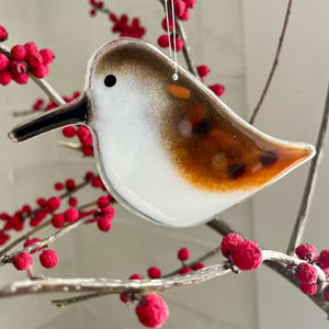 Brown and White Fused Glass Sandpiper hangs on a Branch