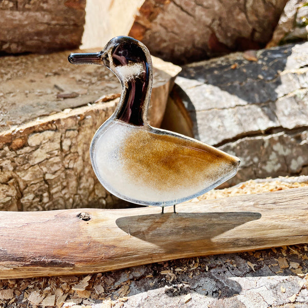 Load image into Gallery viewer, Glass sculpture of a glass canada goose bird on a wooden log with a natural background