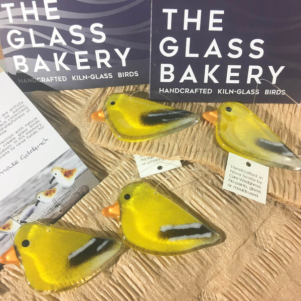 Load image into Gallery viewer, Yellow and Black Hanging Goldfinches next to The Glass Bakery logo