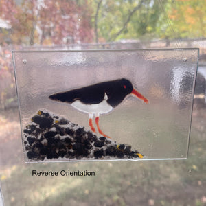 Decorative glass panel with a bird design, showing reverse orientation.