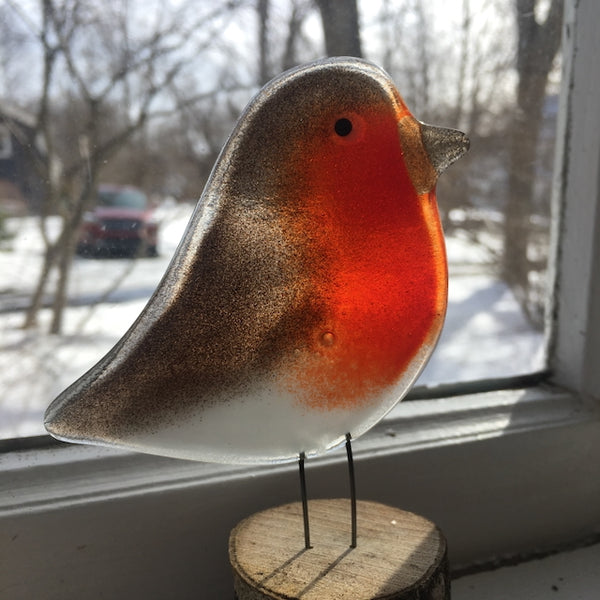 Load image into Gallery viewer, Fused Glass Red and Brown British Robin Adult perched on a wood slice, on a window sill