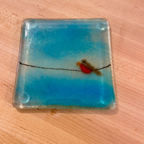 Load image into Gallery viewer, Fused Glass Square glass coaster with a design of a bird on a wire against a blue sky.