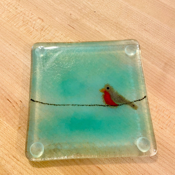 Load image into Gallery viewer, Square fused glass coaster with a bird design on a wooden surface