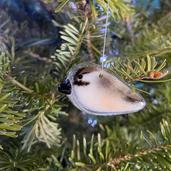 Load image into Gallery viewer, Hanging Chickadee, made from fused glass, hanging on a christmas tree