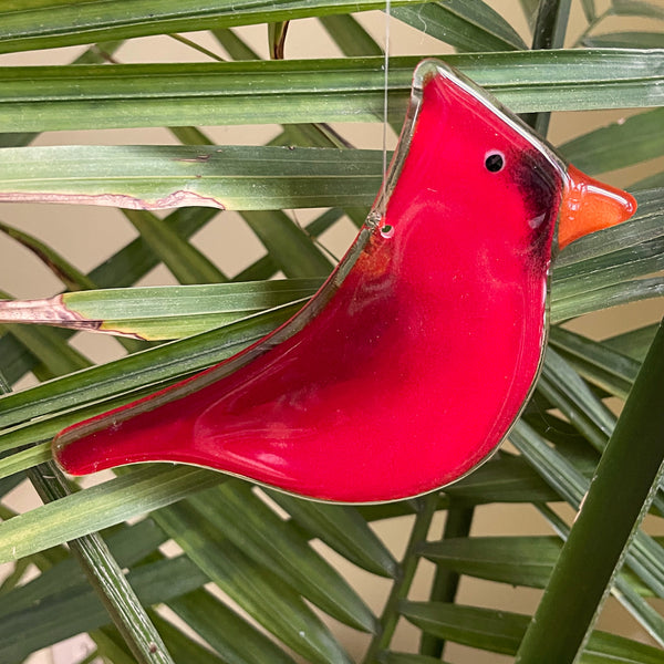 Charger l'image dans la galerie, Red glass bird ornament on green leaves
