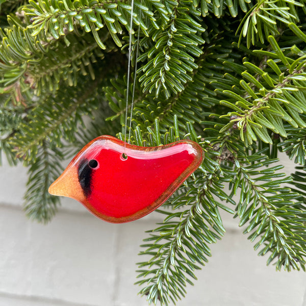 Load image into Gallery viewer, Red cardinal bird ornament hanging on a Christmas tree branch.