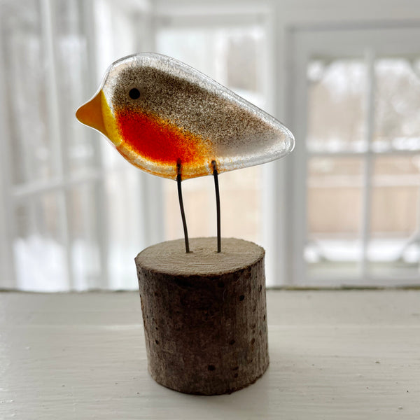 Load image into Gallery viewer, Glass robin bird figurine on a wooden base with a blurred indoor background