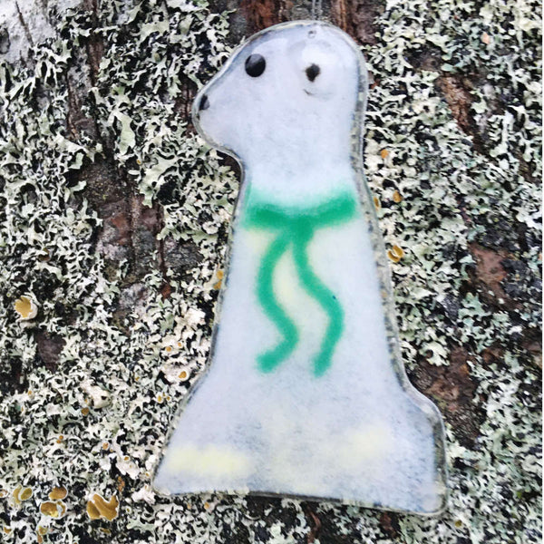 Load image into Gallery viewer, A glass polar bear wearing a green scarf