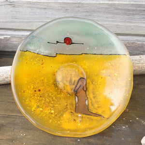 Fused glass dish with dark brown dog with red ball