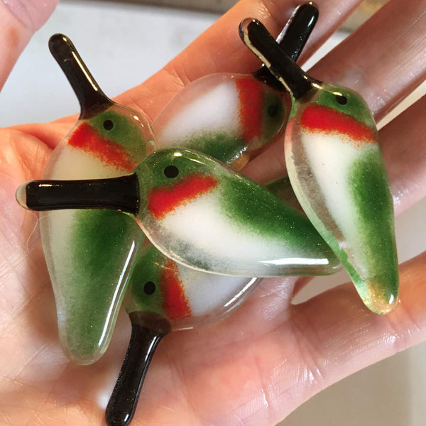 Load image into Gallery viewer, A group of Fused Glass Ruby Throated Hummingbirds in hand