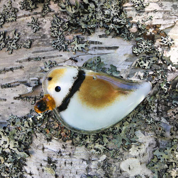 Load image into Gallery viewer, Brown and White glass fused glass Plover ornament hanging against a tree