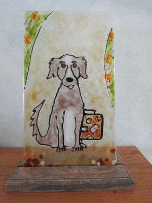 Glass picture of a dog with a suitcase
