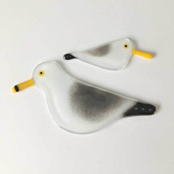 Load image into Gallery viewer, Two glass black, grey and white birds with yellow beaks, created to look like Gulls