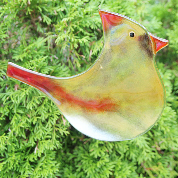 Load image into Gallery viewer, Large Amber and Flame Red Glass Cardinal Bird hanging ornament with cedar tree in the background