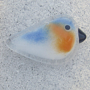 fused glass bluebird baby ornament in sand