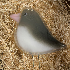 Fused Glass Grey and White Junco Bird Ornament on a nest of wood fibre