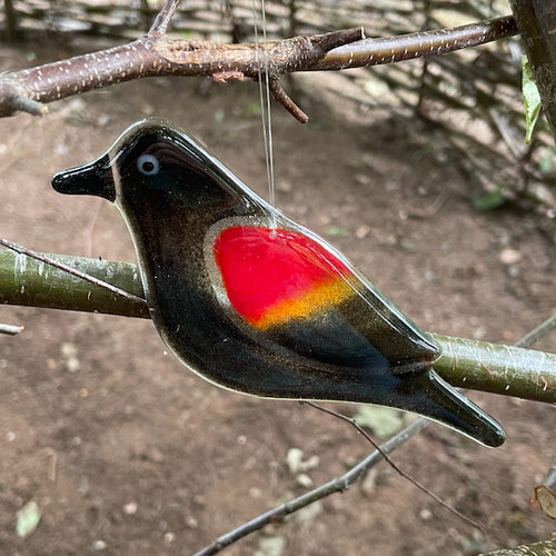 Black, yellow and red hanging fused glass blackbird
