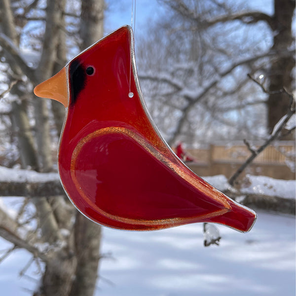 Charger l'image dans la galerie, Red bird-shaped ornament hanging against a snowy background with trees.
