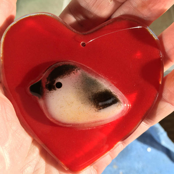 Load image into Gallery viewer, A Fused Glass Heart with Chickadee in Hand
