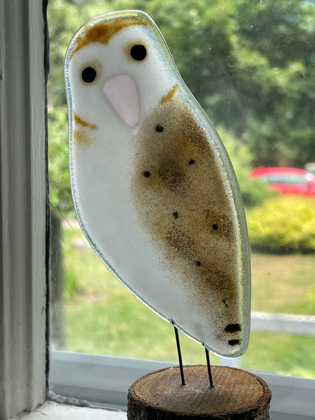 Load image into Gallery viewer, Decorative owl ornament on a wooden base in front of a window with a blurred outdoor view.
