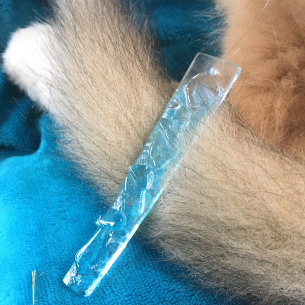 Load image into Gallery viewer, Glass icicle christmas ornament on a puppy tailwith blue fabric in the background
