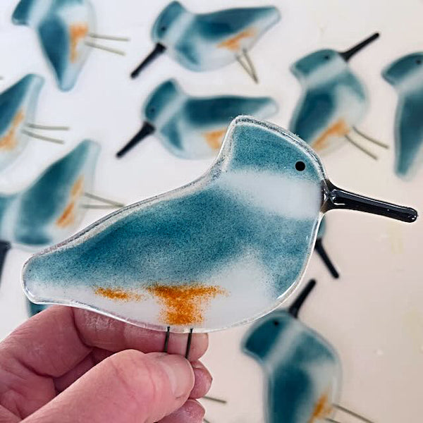 Load image into Gallery viewer, Blue and White Fused Glass perched Kingfisher Ornament held in the hand for scale
