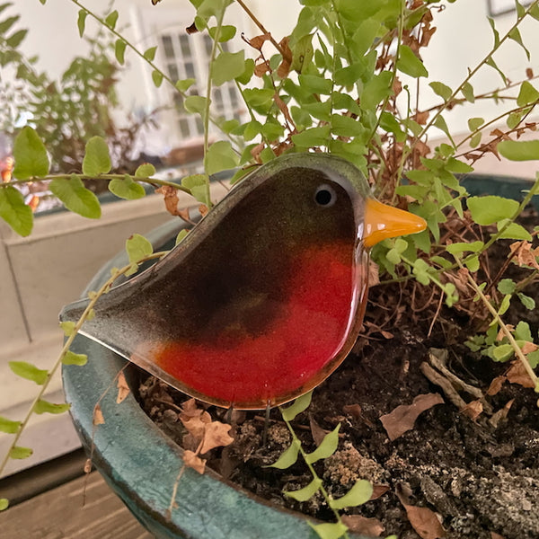 Load image into Gallery viewer, fused glass brown and red brown with gold beak is perched in a planter
