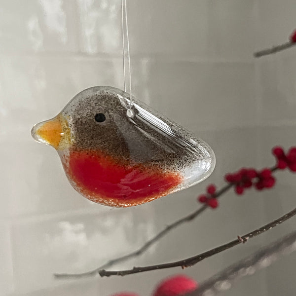 Load image into Gallery viewer, Glass ornament shaped like a robin with red breast and brown back, hanging on a branch with berries.
