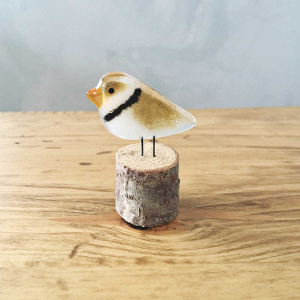 Load image into Gallery viewer, Brown and White Fused Glass Piping Plover Perched on a Log Ornament
