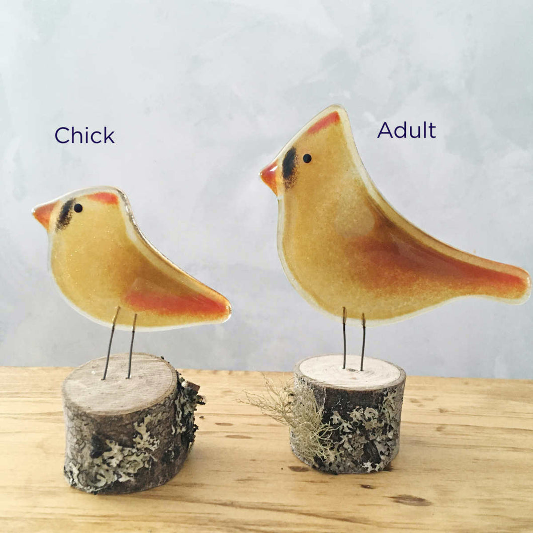 Two female glass Cardinal bird ornaments