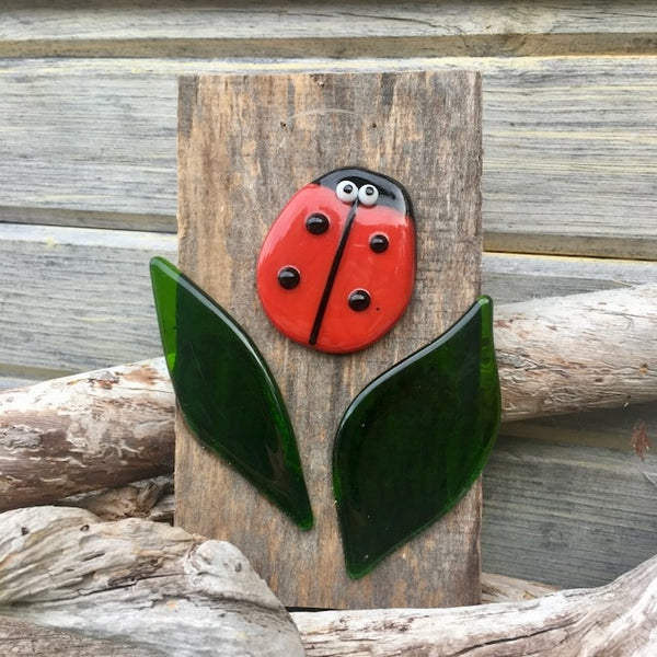 Load image into Gallery viewer, A Fused Glass Ladybug Picture on Driftwood Board 
