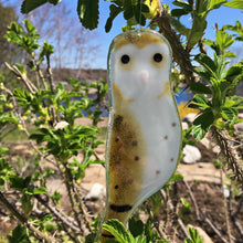 Load image into Gallery viewer, A brown and white glass Barn owl hangs in a thorny rose bush
