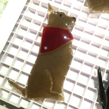 Load image into Gallery viewer, Brown dog with pricked-ears. Dog is wearing a red kerchief. Dog is made of glass.
