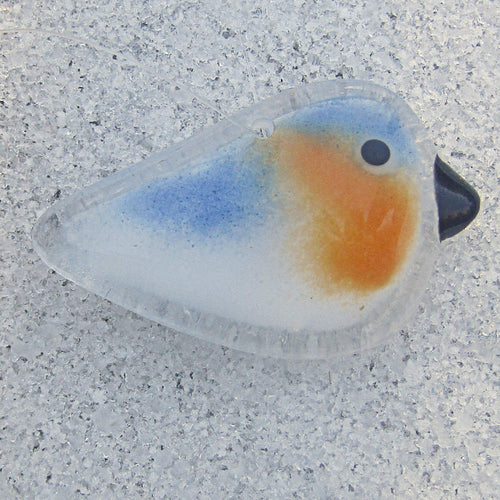 fused glass bluebird baby ornament in sand