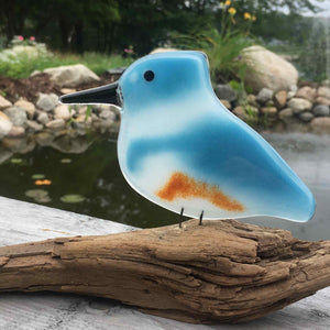 Blue White and Tan Glass Kingfisher Bird sits on Driftwood