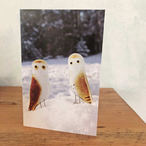 a Christmas card showing two fused glass barn owls in the snow